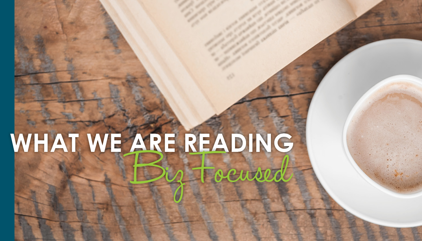 A cup of coffee and a book sit on a desk next to white font reading, "What we are reading: Biz Focused."