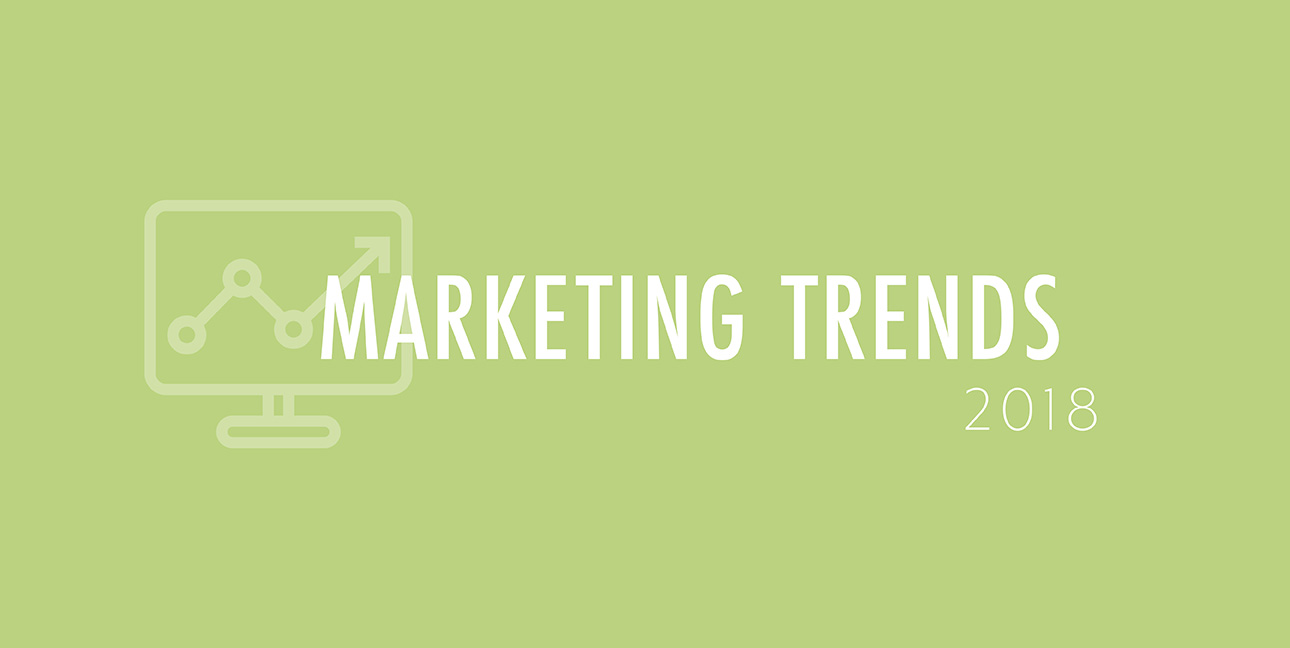 A green background features a cartoon laptop and the words, "Marketing Trends 2018"