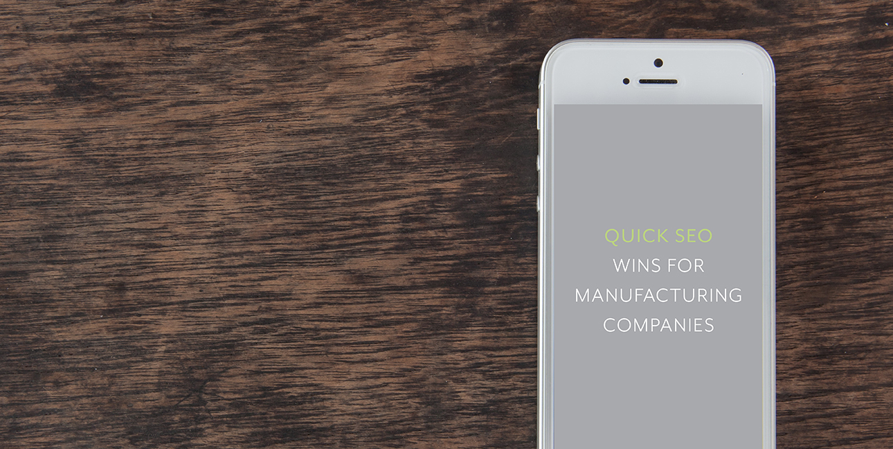An iPhone reads, "Quick SEO wins for manufacturing companies"