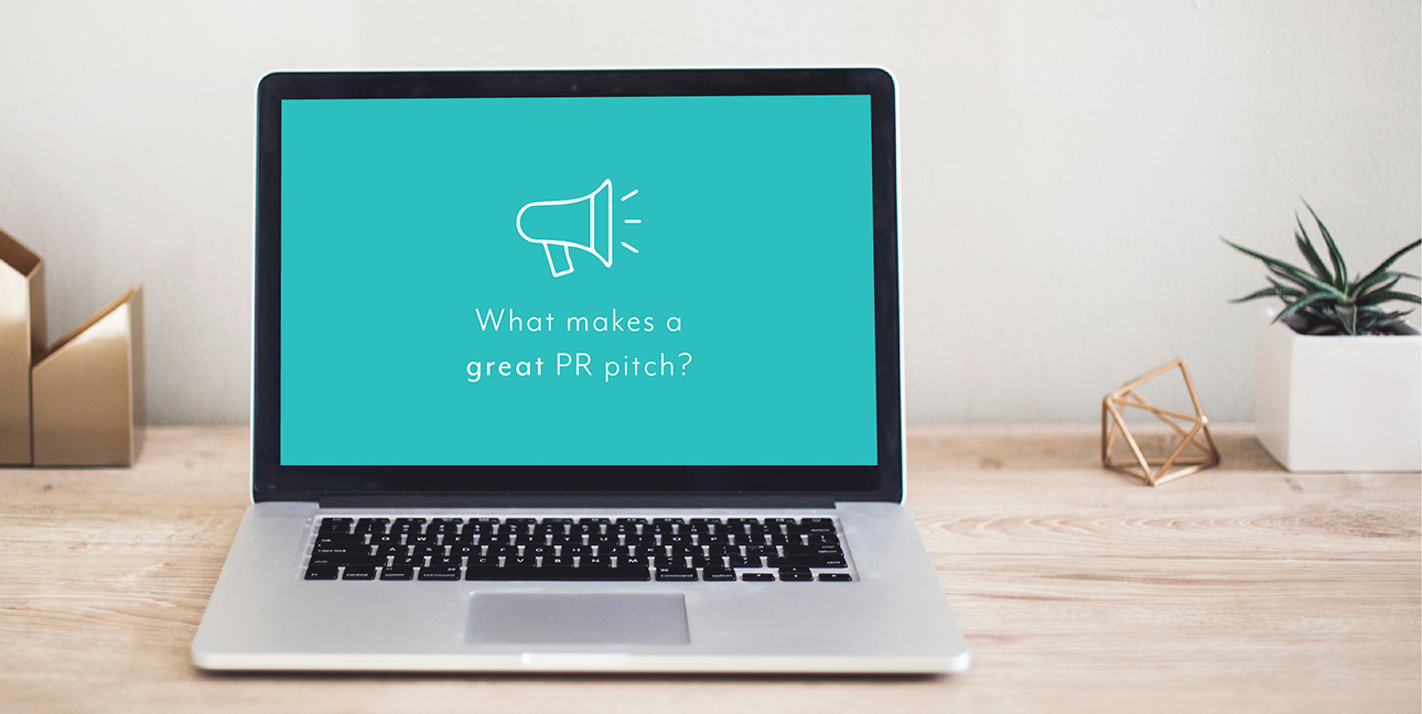 A laptop sits on a desk while the screen shows a blue background and cartoon megaphone reading, "What makes a great PR pitch?"