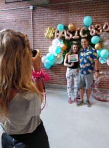 A photo of an 8THIRTYFOUR employee photographing the Creative Lead, Chelsea Miller, and her fiancee.