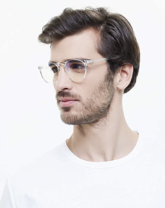 A man wearing clear blue light blocking glasses