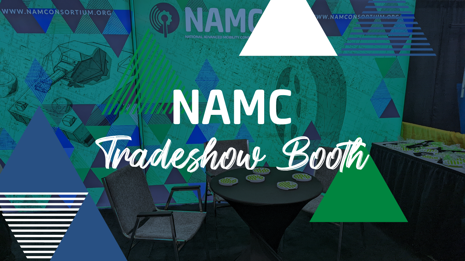 The NAMC trade show booth behind the words, "NAMC Trade Show Booth"