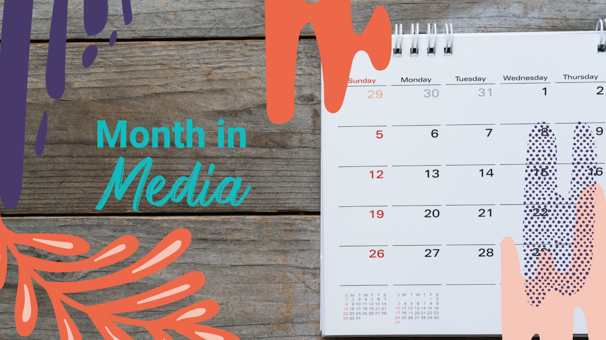 A calendar lies on a wooden table "Month in Media"